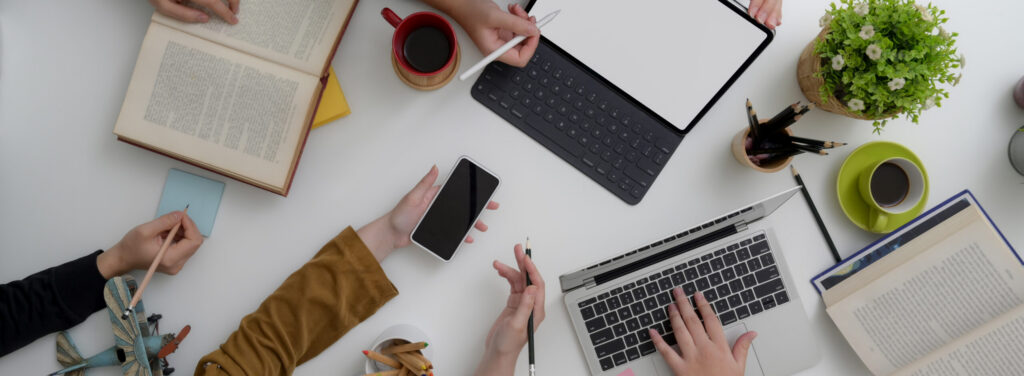 People's hands over a meeting table